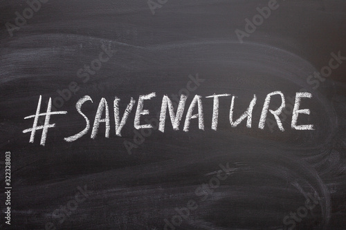 Hashtag save the nature on the chalk Board.