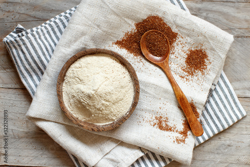 Teff flour in a bowl and teff grain with a spoon