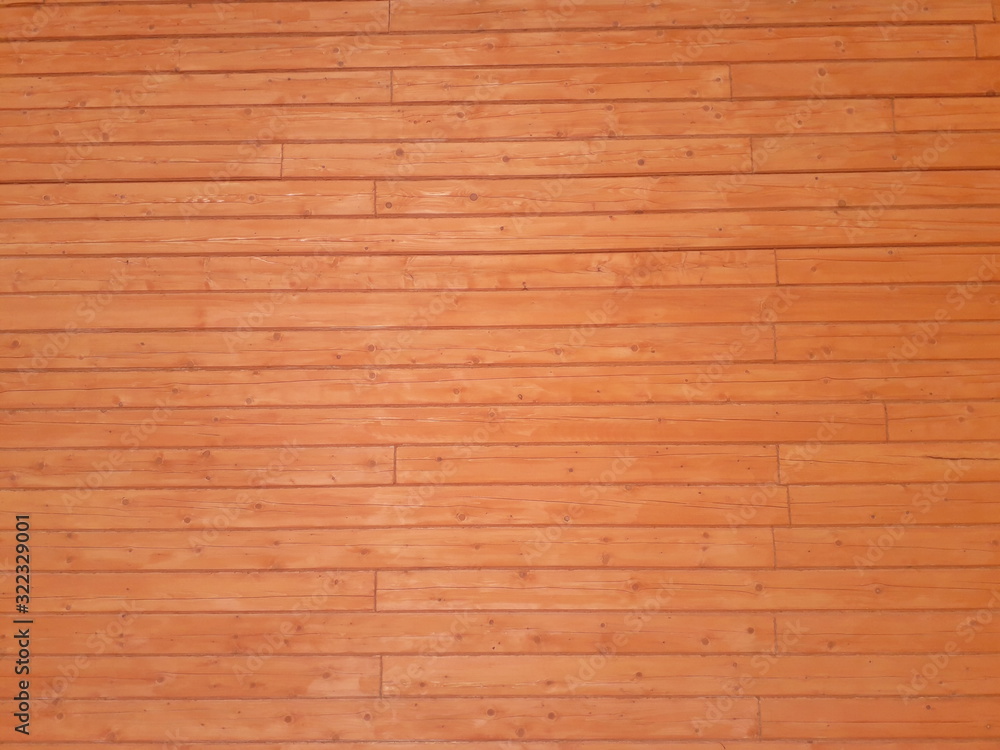 Fototapeta premium Wooden background. Texture of wood. The wall of a wooden house made of timber.