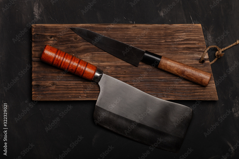Chopping knives on a dark table