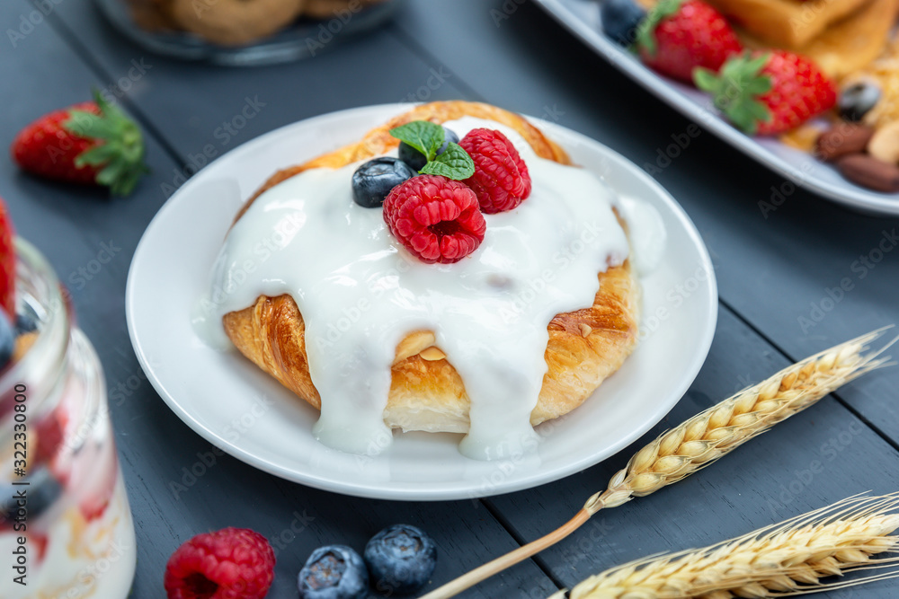 Yogurt and bread with berry on top Yogurt and bread with berry on top