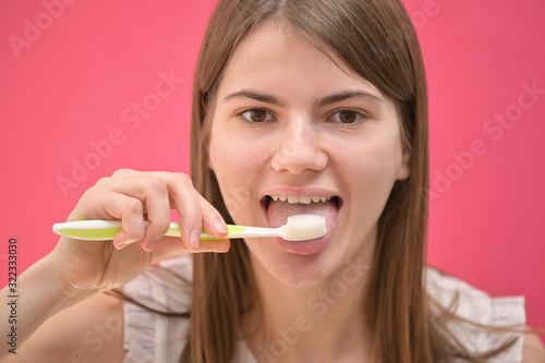 Woman Cleaning Tongue