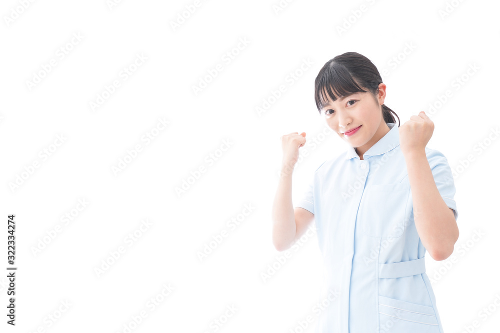 ガッツポーズをする若い看護師 ガッツポーズをする若い看護師