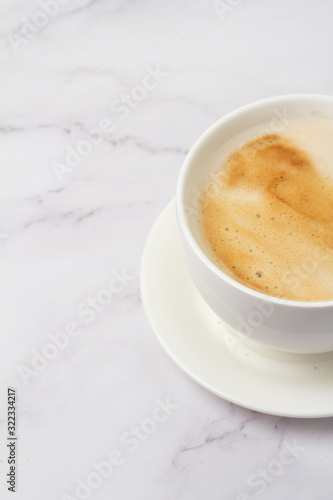 cappuccino in a white cup on a white background
