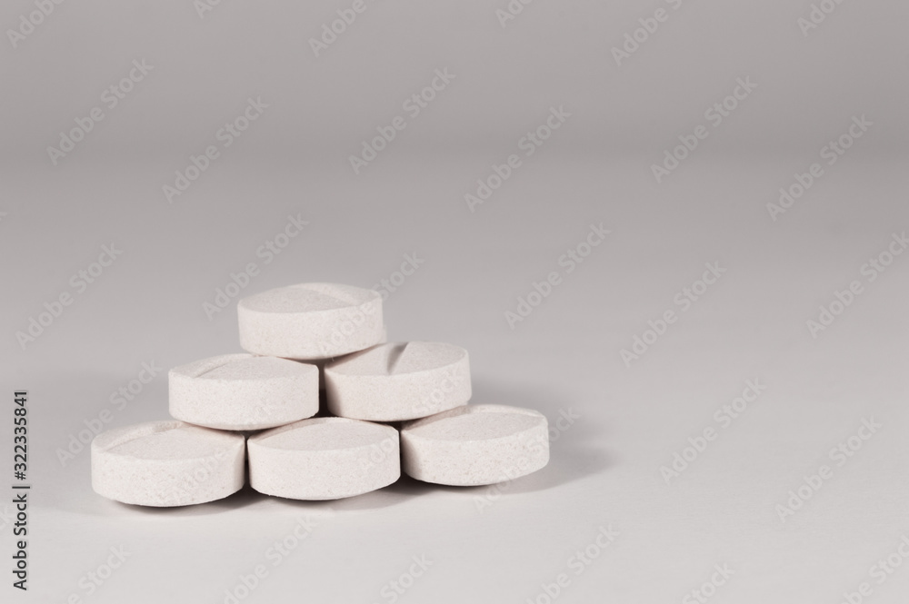 White medical pills and tablets with bottle White medical pills and tablets with bottle
