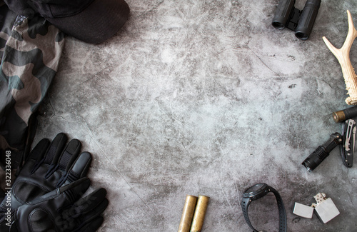 Hunting accessories on a dark background, tactical equipment. Hunting tactical background. The concept of hunting.
