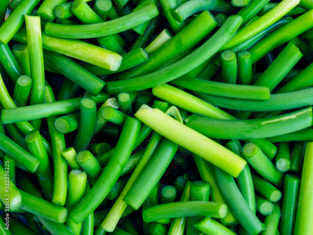 Sliced garlic sticks are very tender and delicious. They are also known as garlic spears , stems , or tops . Sliced garlic sticks are very tender and delicious. They are also known as garlic spears , stems , or tops .