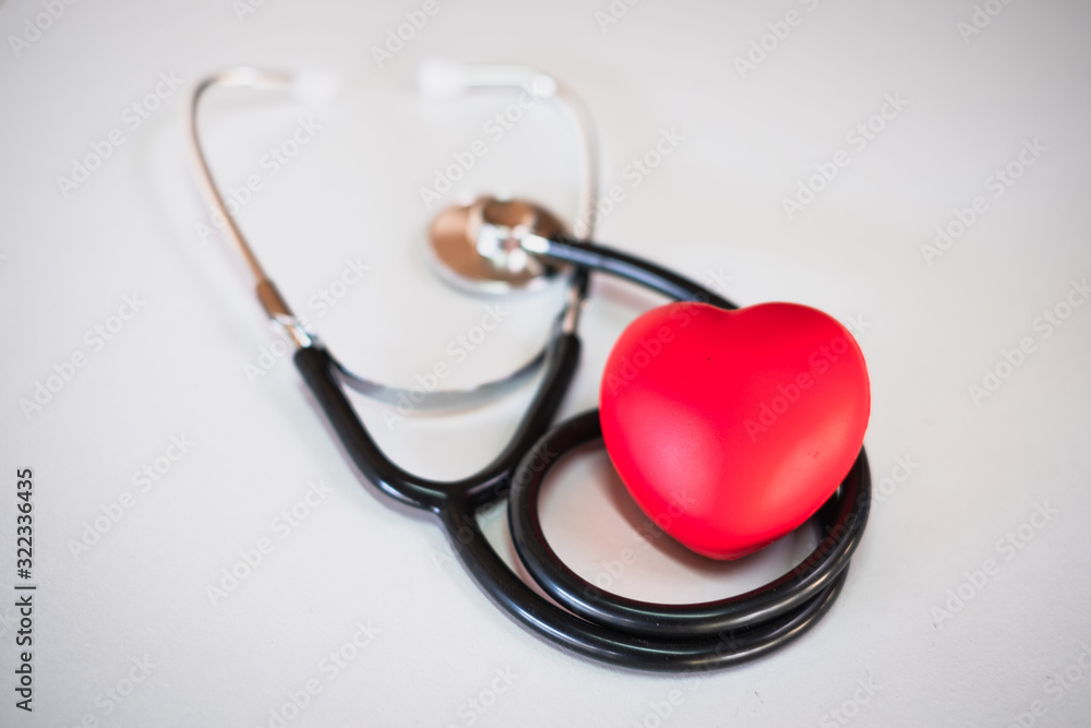 Red heart and stethoscope Placed on a white background With spaces to put text Heart health concepts, health insurance, World Health Day, human health that needs to be examined and treated. Red heart and stethoscope Placed on a white background With spaces to put text Heart health concepts, health insurance, World Health Day, human health that needs to be examined and treated.