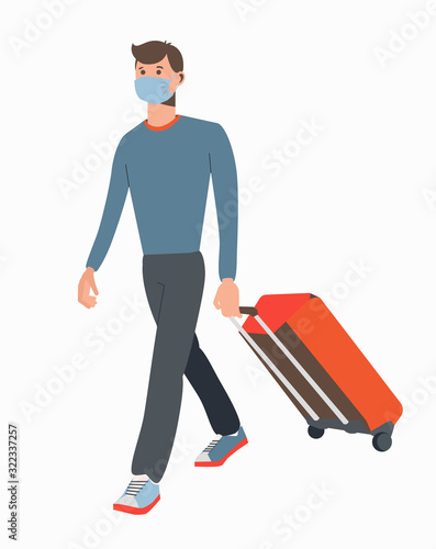 A guy with a valise in a medical mask.