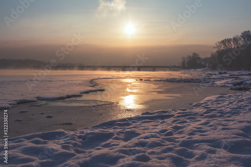 Winter landscape near the river and bridge