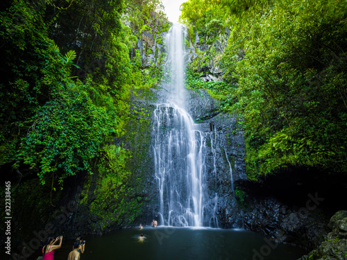 Maui  Hawaii Hana Highway - Wailua Falls  near Lihue  Kauai. Road to Hana connects Kahului to the town of Hana Over 59 bridges  620 curves  tropical rainforest