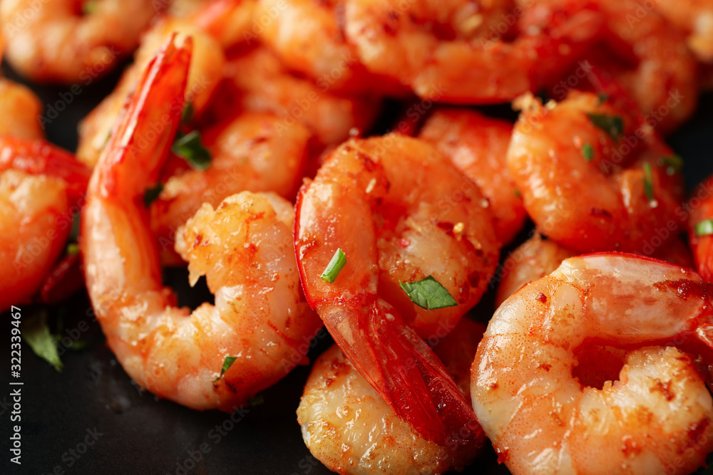 Delicious cooked shrimps on plate, close up Delicious cooked shrimps on plate, close up