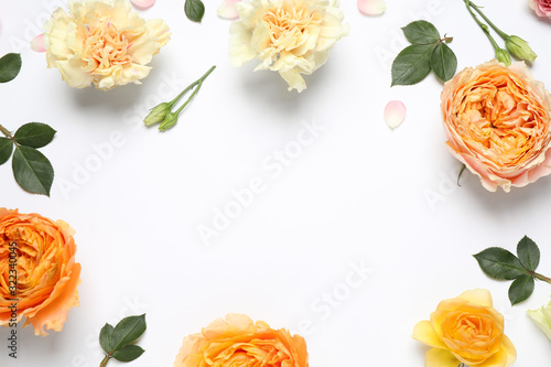 Frame made of beautiful flowers on white background, flat lay with space for text. Floral composition