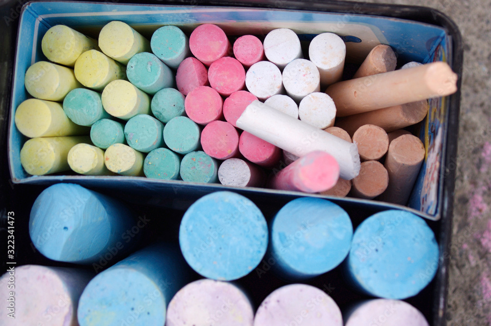 container full of rainbow colored sidewalk chalk container full of rainbow colored sidewalk chalk