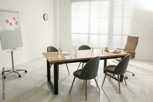 Wallpaper Mural Simple office interior with large table and chairs Torontodigital.ca