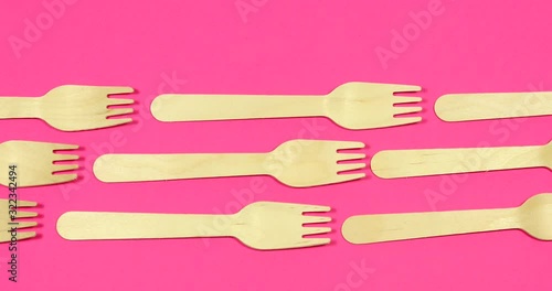 Stop motion Disposable appliance background for a meal of wood. Eco concept.