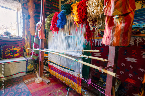Traditional weaving machine used to produce famous Berber carpets, Morocco © malajscy