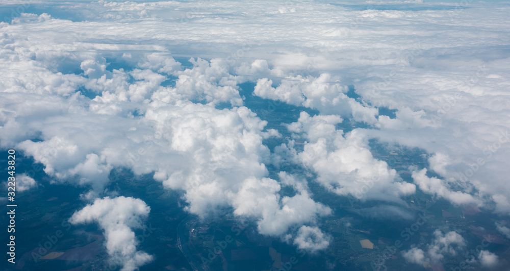 Sky with clouds from airplane window during flight. Sky with clouds from airplane window during flight.