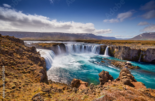 Panorama of most famous place of Golden Ring Of Iceland. Godafoss waterfall near Akureyri in the Icelandic highlands  Europe. Popular tourist attraction. Travelling concept background. Postcard.