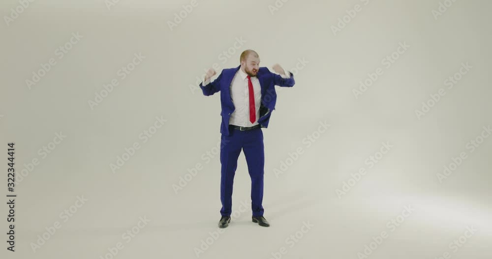 Young, confident and smartly dressed businesman shaking head and arms vigorously on a white background - Slow Motion, Wide Shot Young, confident and smartly dressed businesman shaking head and arms vigorously on a white background - Slow Motion, Wide Shot