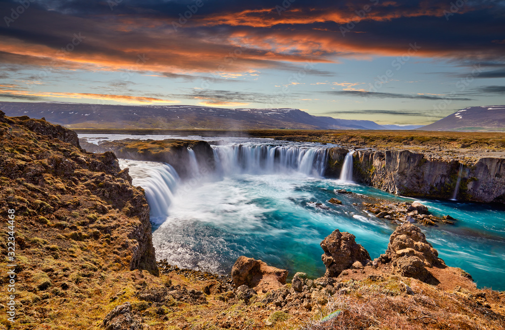 Panorama of most famous place of Golden Ring Of Iceland. Godafoss waterfall near Akureyri in the Icelandic highlands, Europe. Popular tourist attraction. Travelling concept background. Postcard..