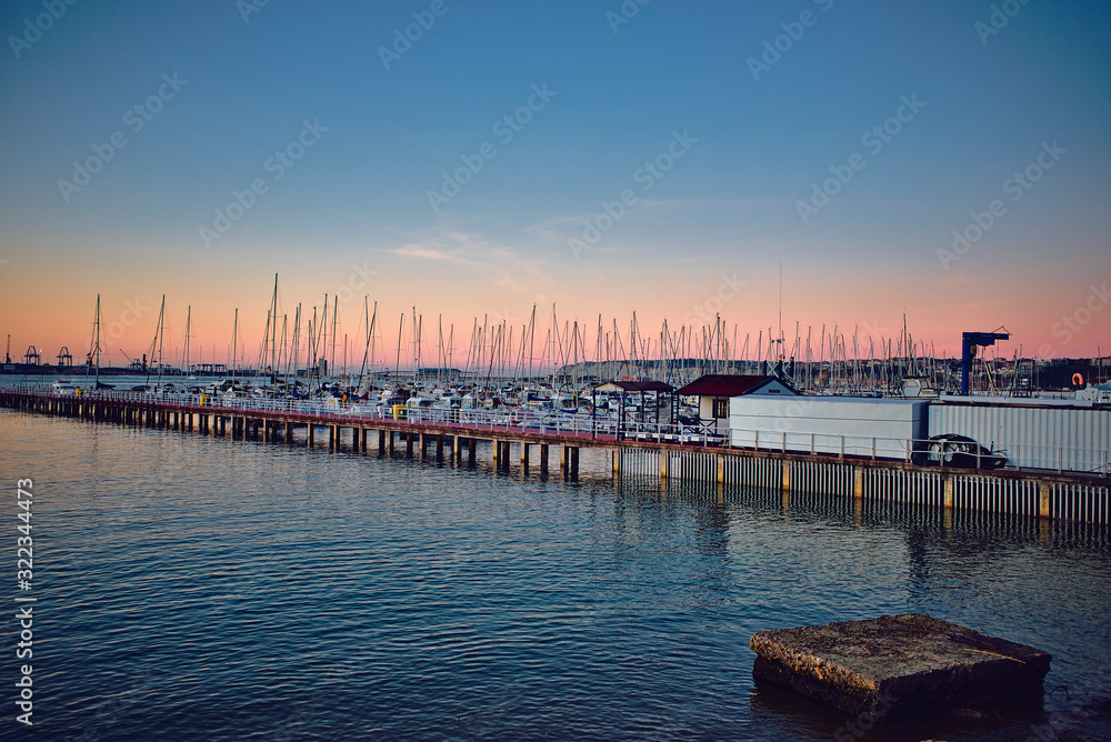 Boats on the pier at sunset