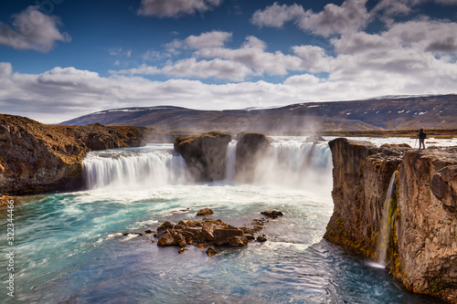 Panorama of most famous place of Golden Ring Of Iceland. Godafoss waterfall near Akureyri in the Icelandic highlands, Europe. Popular tourist attraction. Travelling concept background. Postcard.