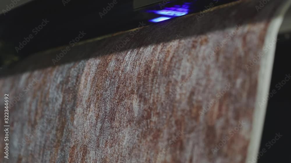 Industrial printer making new wallpaper sample. Modern wallpaper