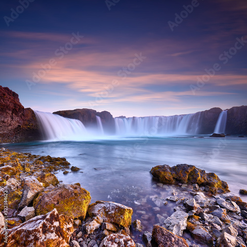 Panorama of most famous place of Golden Ring Of Iceland. Godafoss waterfall near Akureyri in the Icelandic highlands, Europe. Popular tourist attraction. Travelling concept background. Postcard.