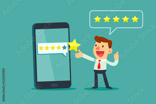 businessman give five star rating on smartphone screen