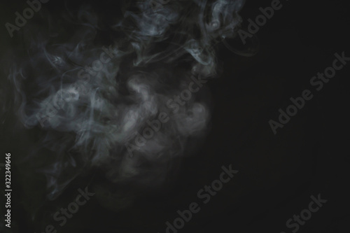 Smoke in the dark. fog on the black background
