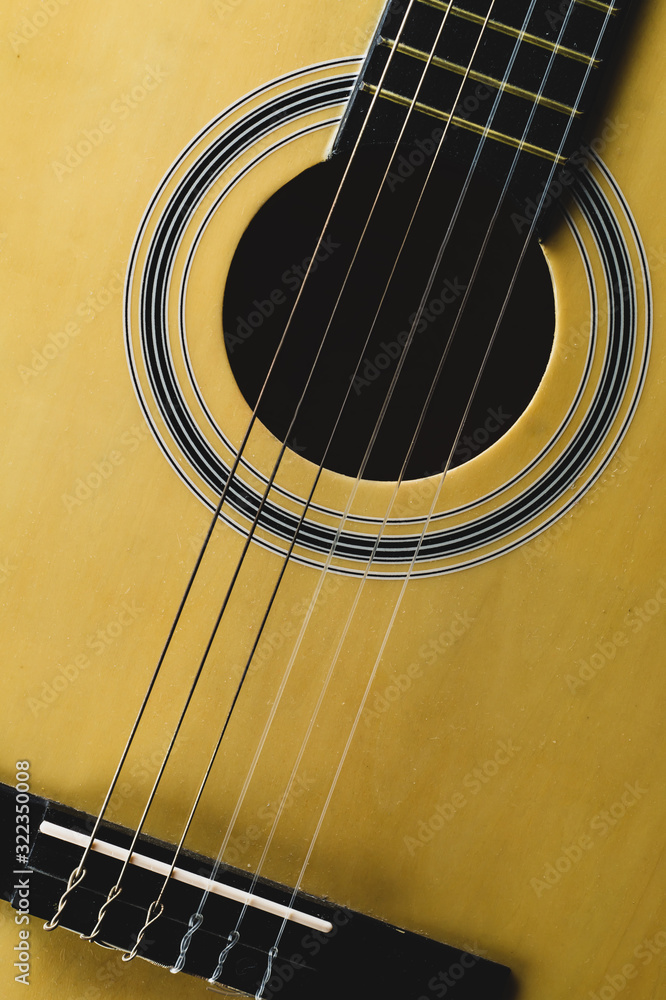 Guitar close up. acoustic musical instrument. strings on the guitar neck Guitar close up. acoustic musical instrument. strings on the guitar neck