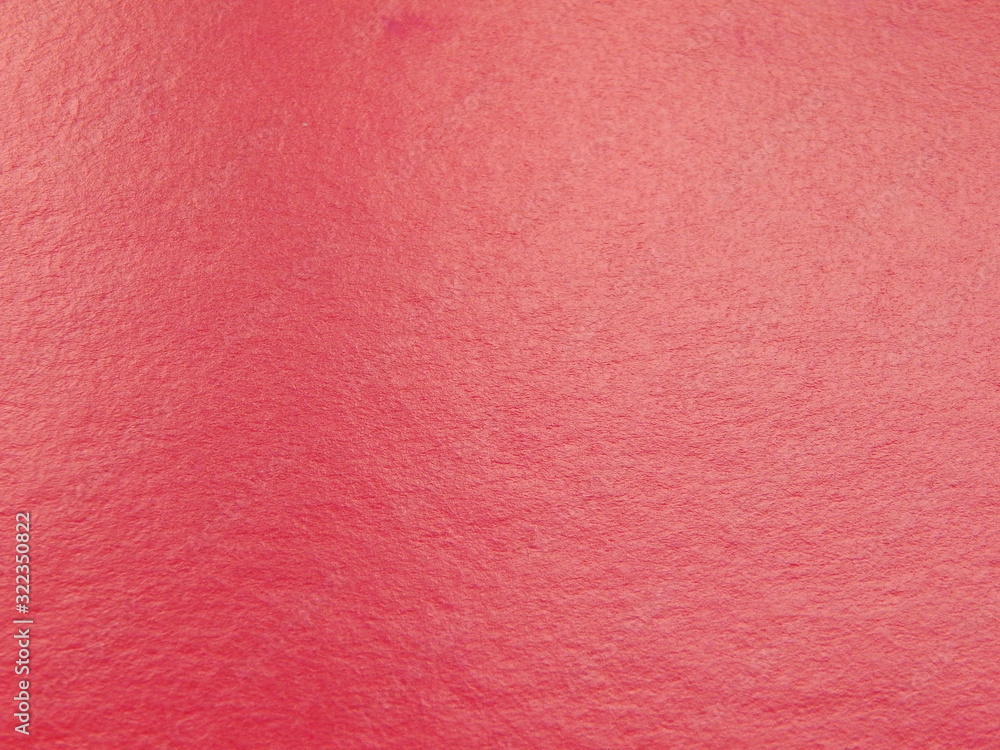 Fototapeta premium Red paper texture, background with space for text or image.