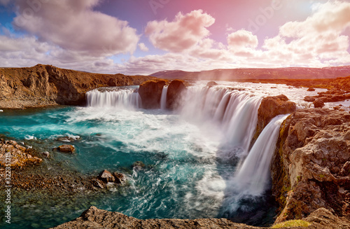 Panorama of most famous place of Golden Ring Of Iceland. Godafoss waterfall near Akureyri in the Icelandic highlands  Europe. Popular tourist attraction. Travelling concept background. Postcard.