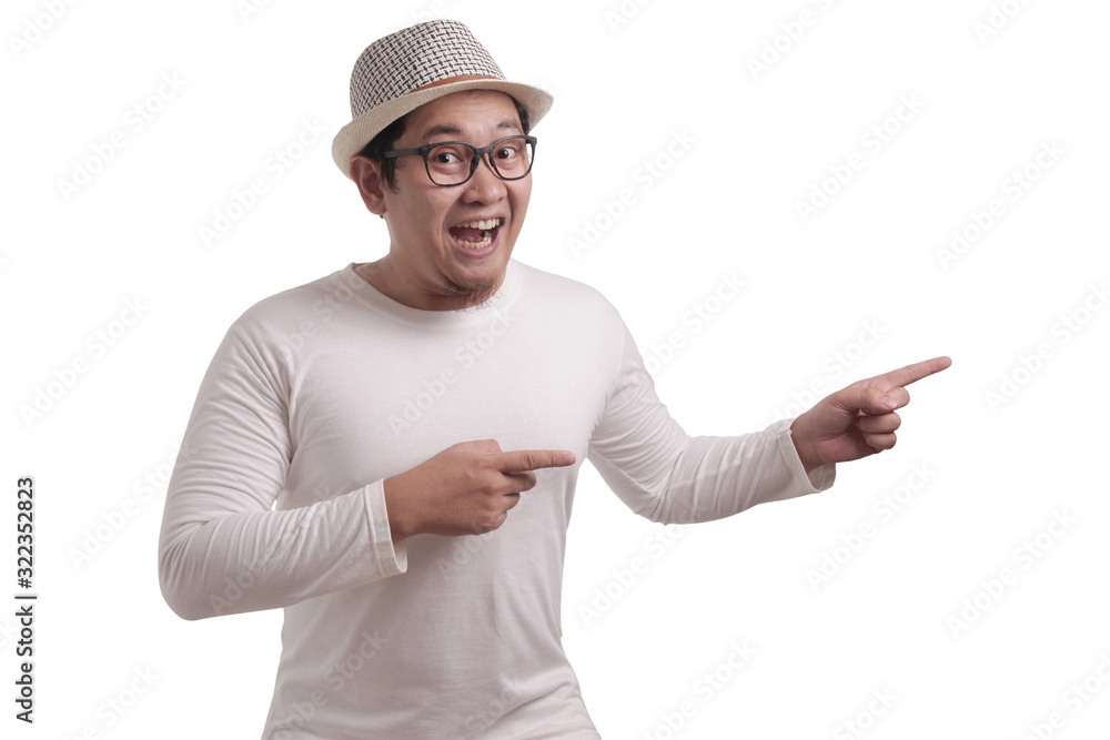 Young Man Showing and Pointing Something on His Side Young Man Showing and Pointing Something on His Side