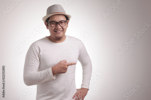 Young Man Showing and Pointing Something on His Side