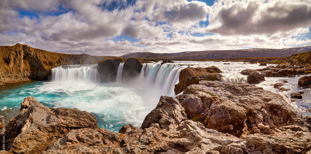 Fototapeta premium Panorama of most famous place of Golden Ring Of Iceland. Godafoss waterfall near Akureyri in the Icelandic highlands, Europe. Popular tourist attraction. Travelling concept background. Postcard.