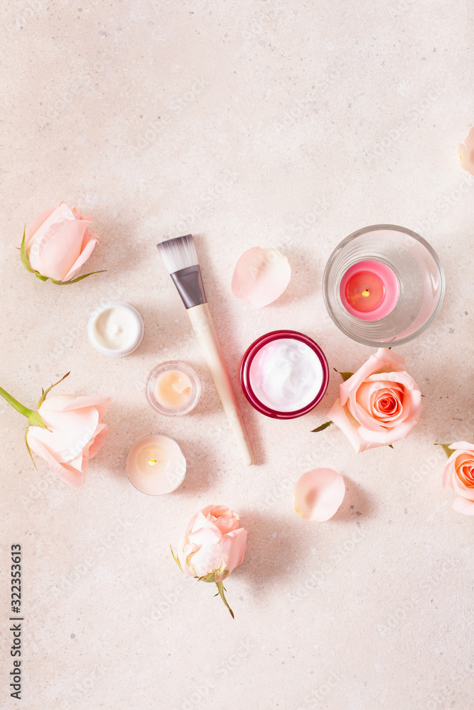 skincare products and rose flowers. natural cosmetics for home spa treatment
