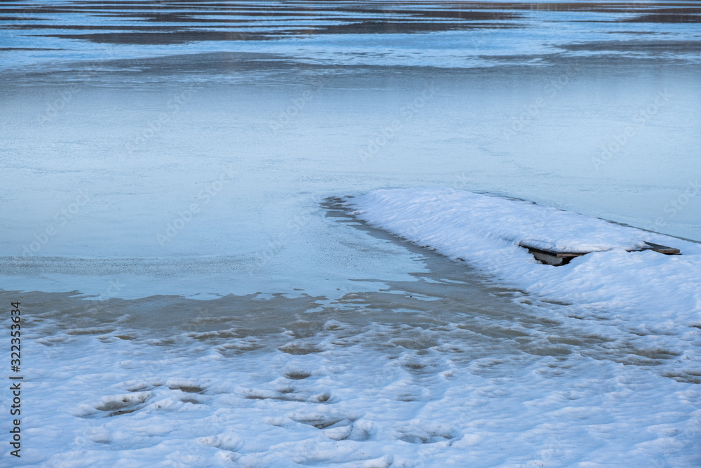 Frozen lake with snow with footprints in winter in sweden Frozen lake with snow with footprints in winter in sweden
