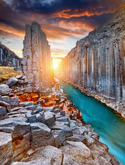Studlagil basalt canyon, Jokulsa a Dal River. Iceland, Europe.  One of the most wonderfull hidden place and nature sightseeing. Famous tourist landscape with basalt rock formations. Travel postcard.