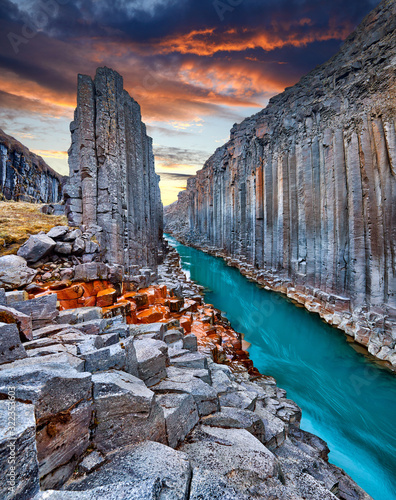 Studlagil basalt canyon, Jokulsa a Dal River. Iceland, Europe.  One of the most wonderfull hidden place and nature sightseeing. Famous tourist landscape with basalt rock formations. Travel postcard.
