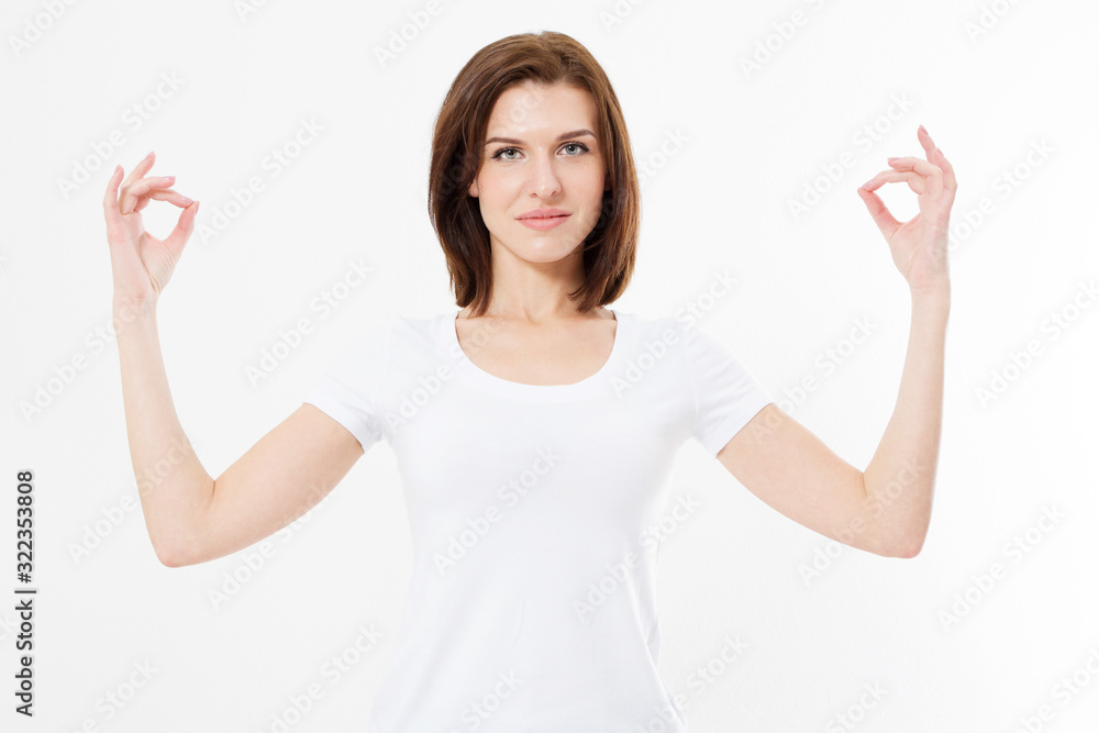 Woman standing in yoga zen position. Portrait of girl meditating in pose of zen in isolation. Yoga concept mock up. One caucasian lady exercising yoga meditating in studio over white Woman standing in yoga zen position. Portrait of girl meditating in pose of zen in isolation. Yoga concept mock up. One caucasian lady exercising yoga meditating in studio over white