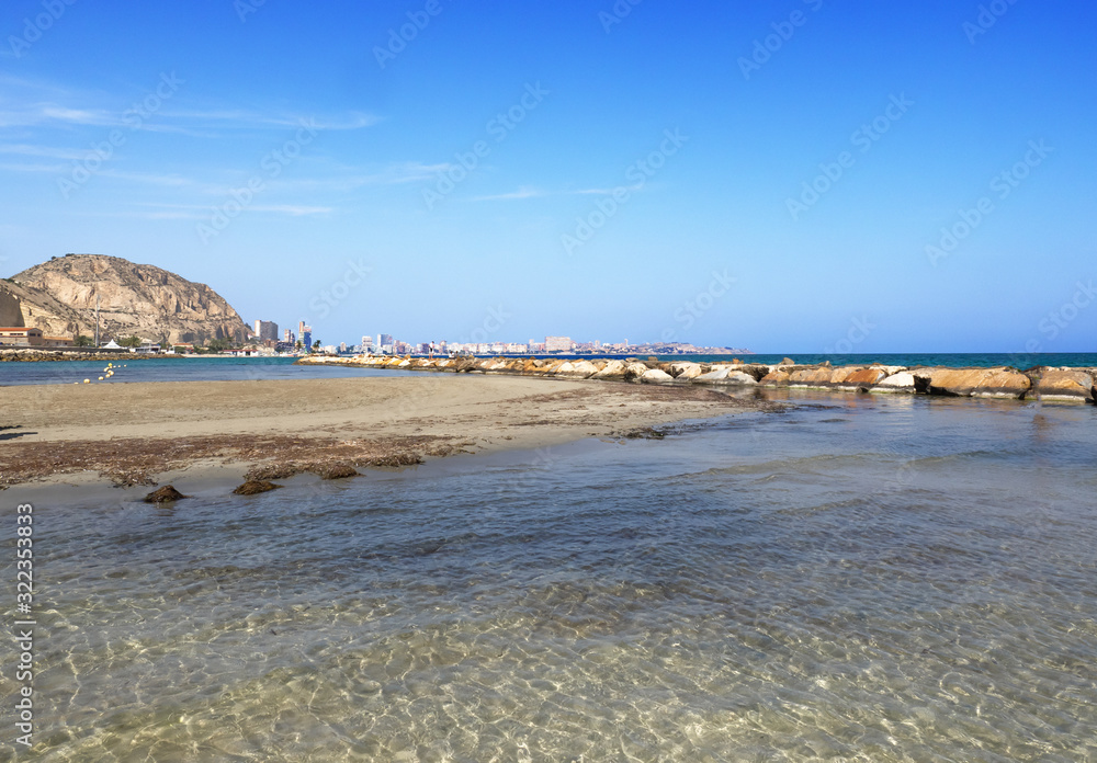 a long sandy beach with crystal clear water on the Costa Blanca. Alicante - Spain a long sandy beach with crystal clear water on the Costa Blanca. Alicante - Spain