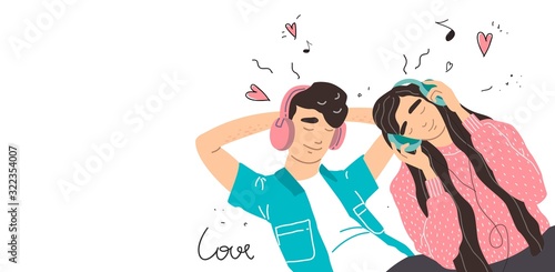 Lovers boy and girl listen to music on headphones