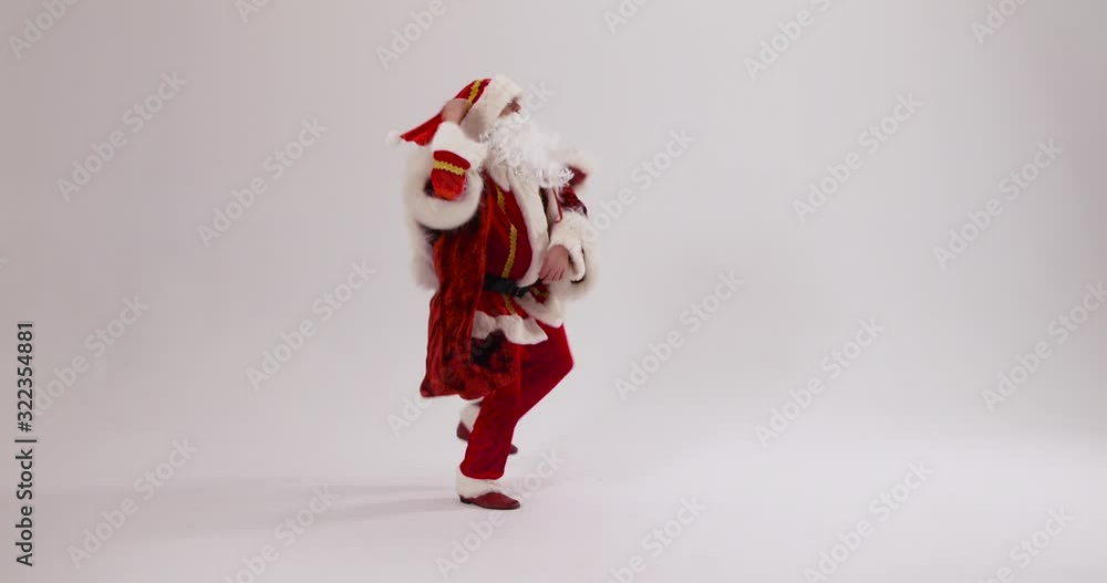 Crazy Santa performing gangnam Style dance on a White Background - Wide Shot Crazy Santa performing gangnam Style dance on a White Background - Wide Shot