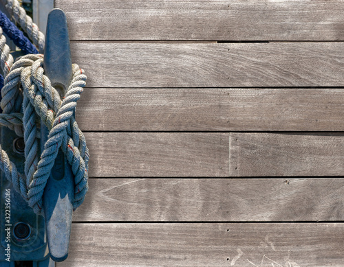 Fotografie Mooring cleat on a wooden pier.