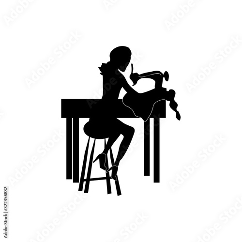 woman working at a sewing machine black silhouette