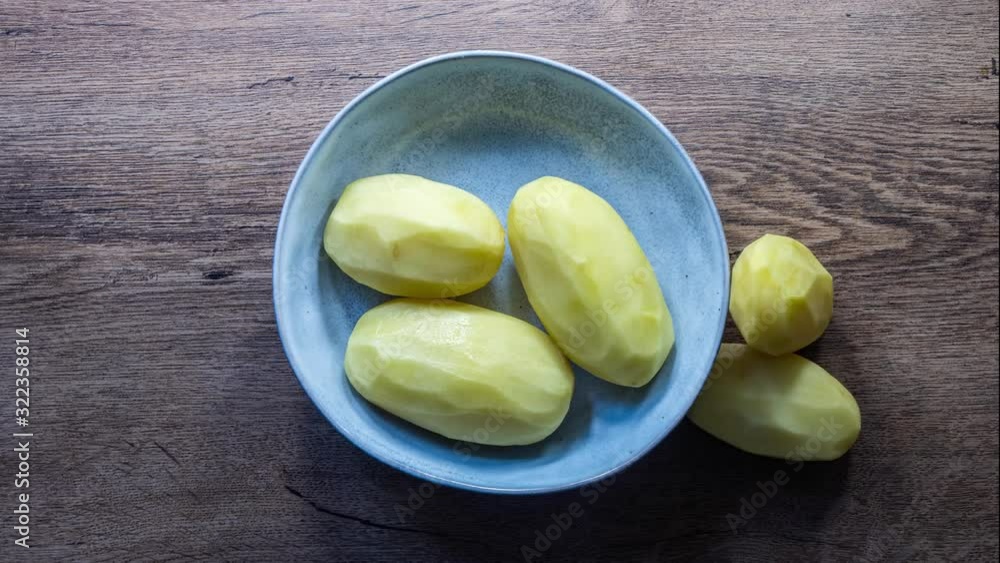 Potatoes peeling stop motion, 4k shot