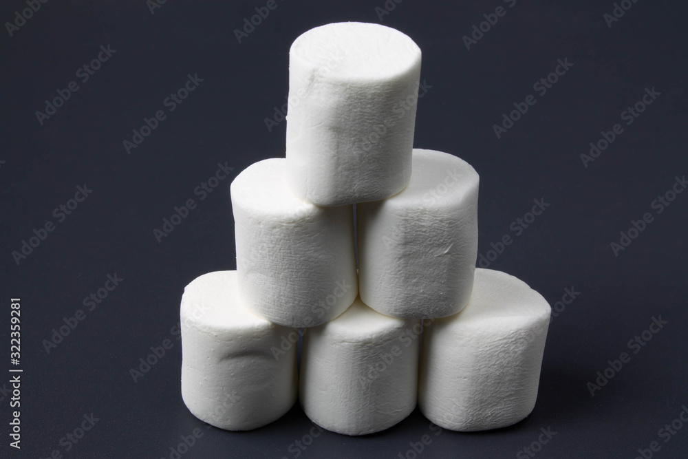 White marshmellow close up on dark background White marshmellow close up on dark background
