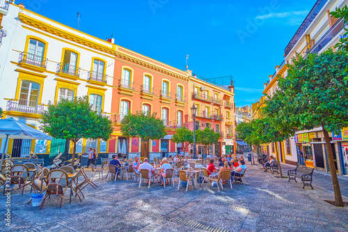 Fototapeta Naklejka Na Ścianę i Meble -  The small square with outdoor cafes, Seville, Spain